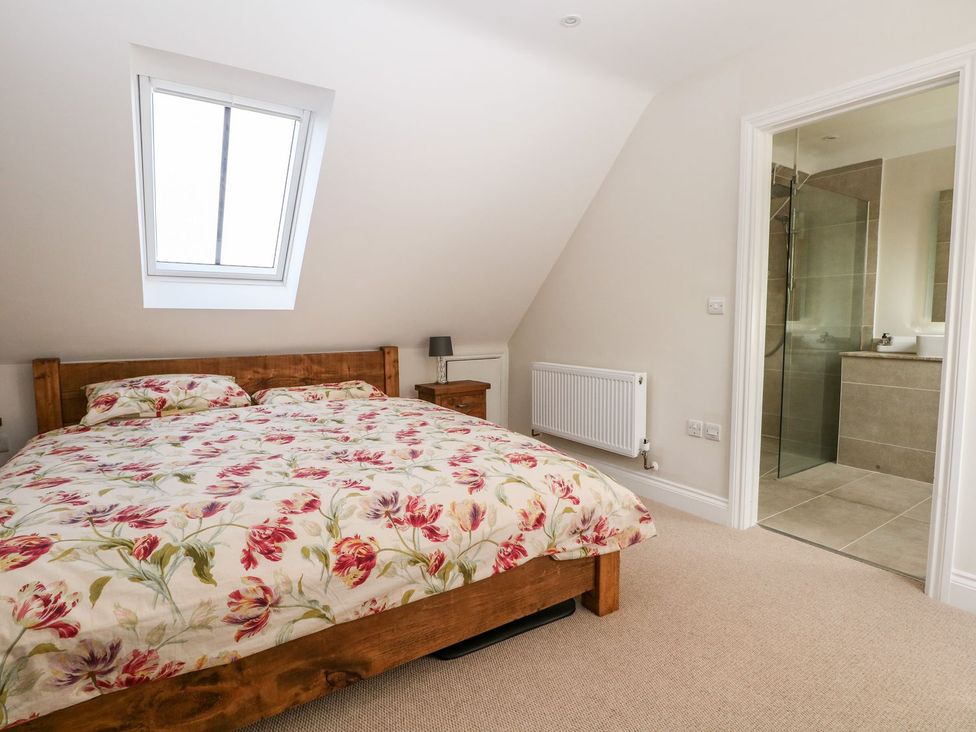 A bedroom with a bed and ensuites at The Granary 2 Bed in Bordon
