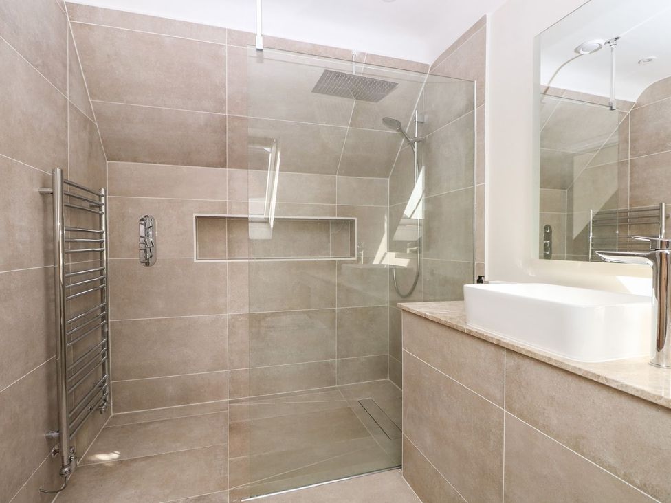 A bathroom with a shower and a sink at The Granary 2 Bed in Bordon