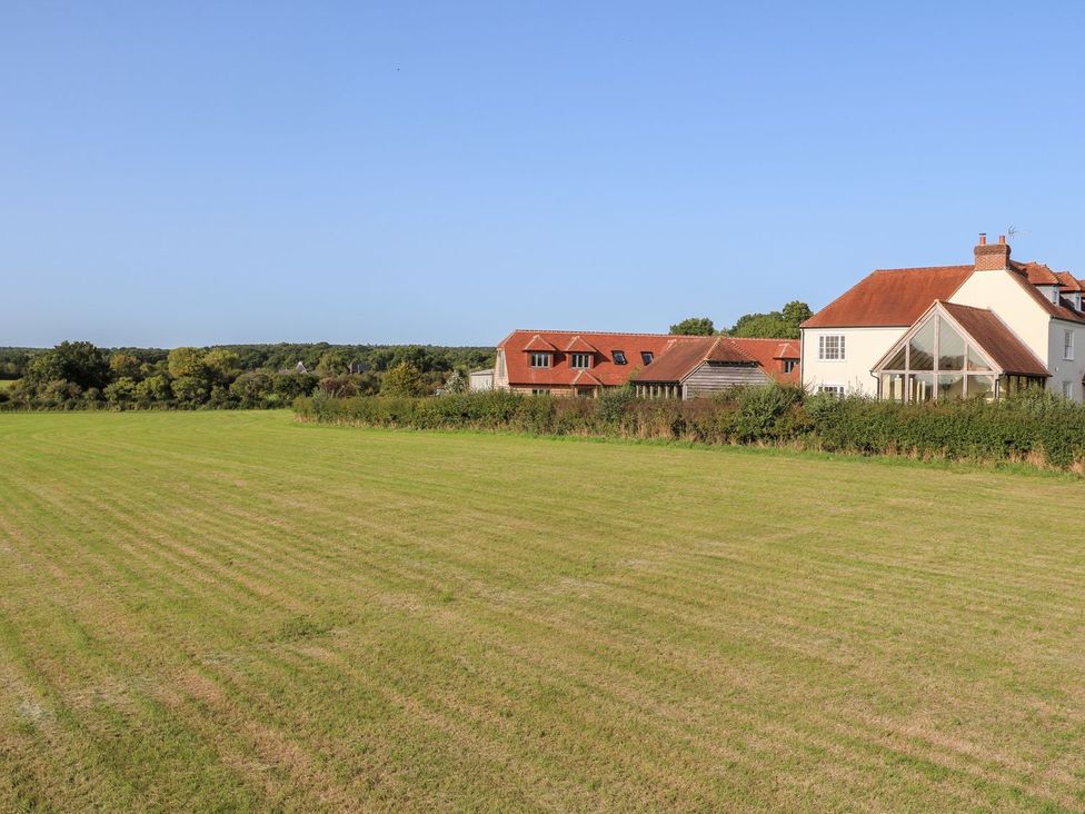 A view of houses and a field at The Granary 2 Bed in Bordon
