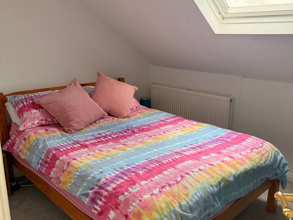 A bedroom with a bed and pillows at 9 Market View Buxton
