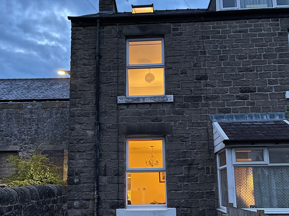A view of the exterior of a house with visible windows and a chimney at 9 Market View Buxton