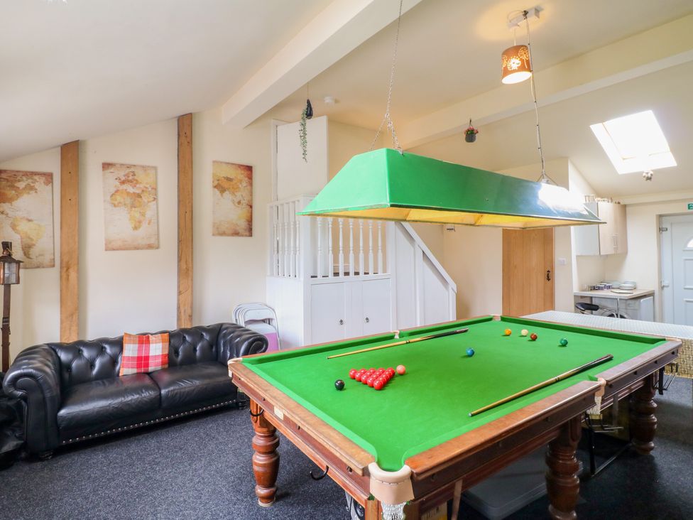 A games room featuring a snooker table and a couch at Greystones - Apartment C near Buxton