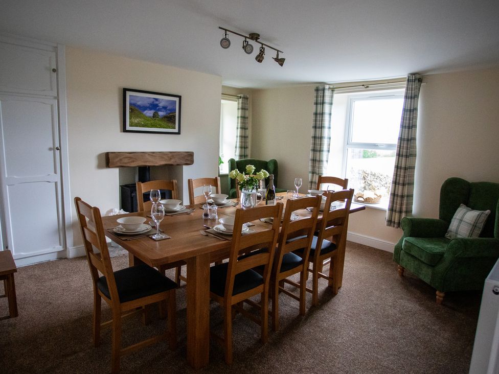 A dining room with a table and chairs at Gap Farm in Brampton