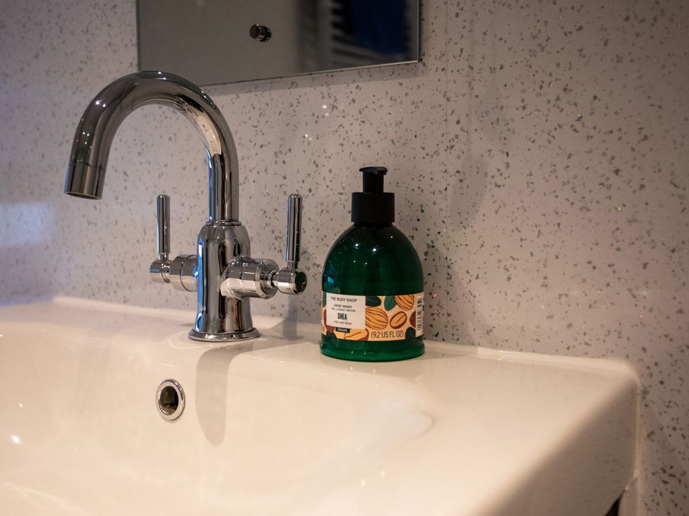 A sink with a faucet and a soap dispenser at Gap Farm in Brampton