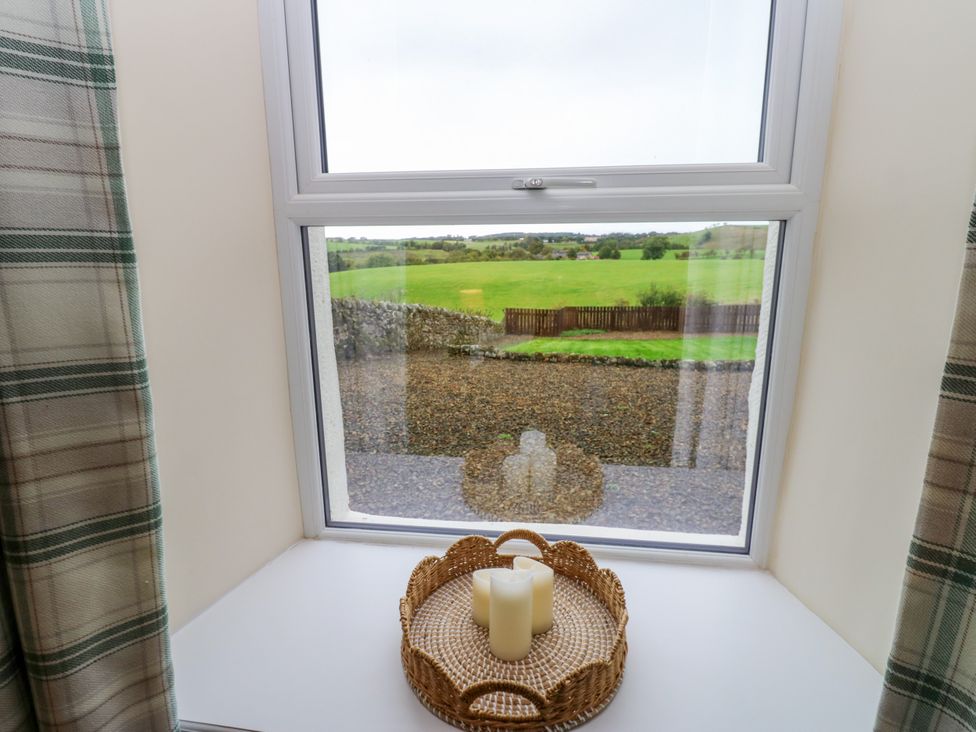 A window with a candle on a table at Gap Farm in Gilsland