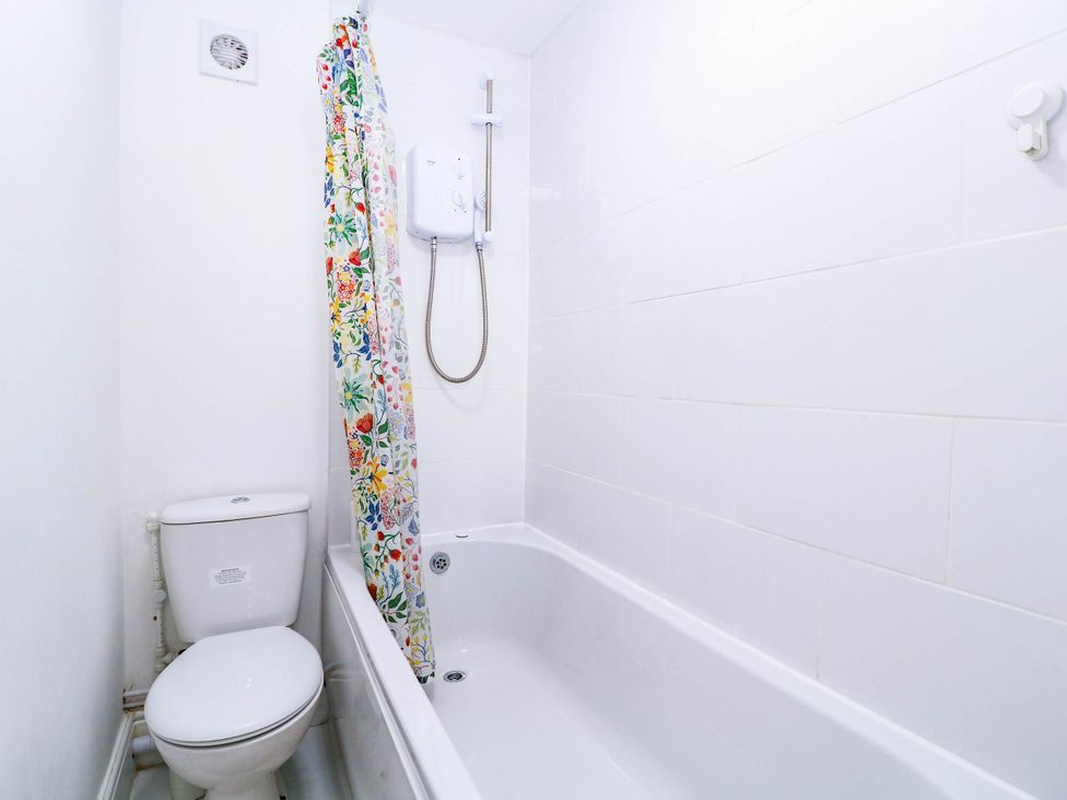 A bathroom with a bathtub and a toilet at 6 Caxton Place Newport, South Wales