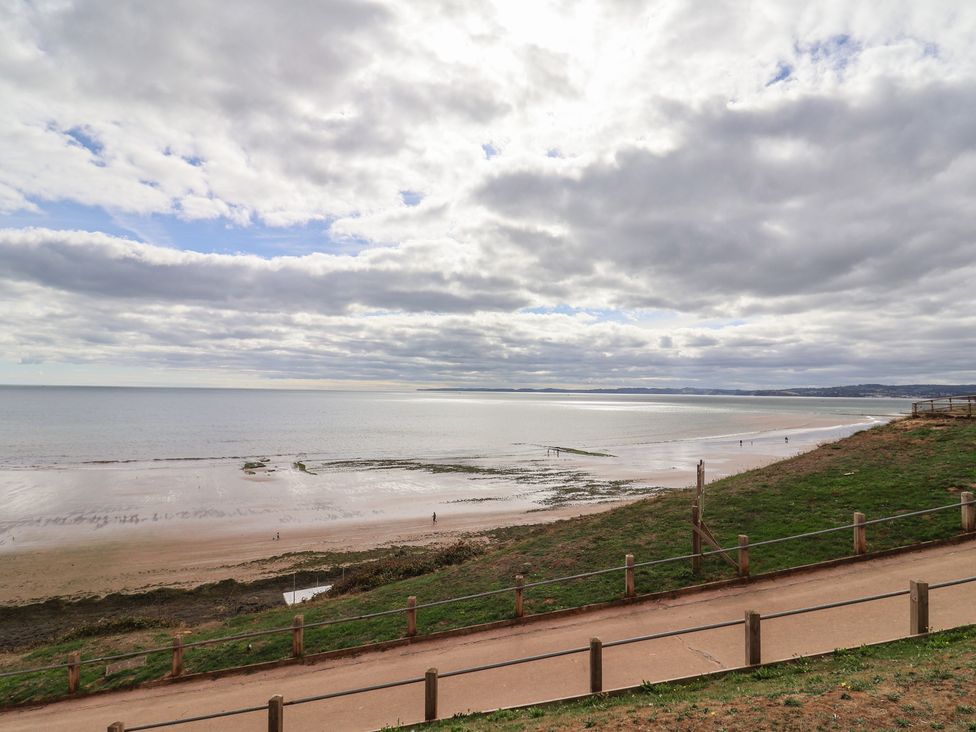 A beach with a pathway and people walking at Spruces 30, Sandy Bay, Exmouth