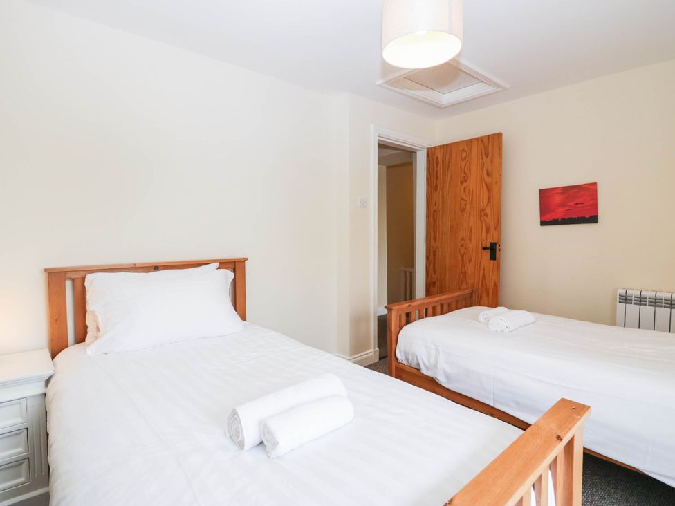 A bedroom with two beds at Holly in Cleator