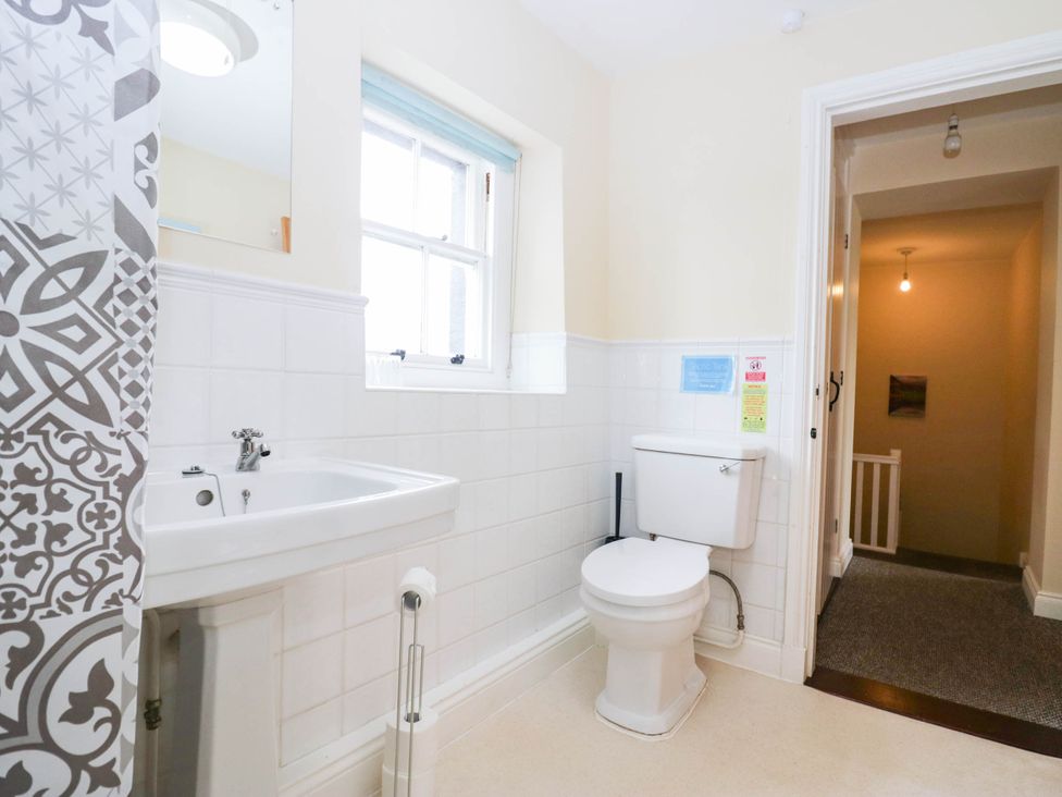 A bathroom with a sink and toilet at Holly in Cleator