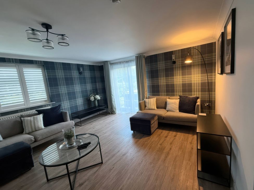 A living room with a sofa and coffee table at Ridings Annex in Tonbridge
