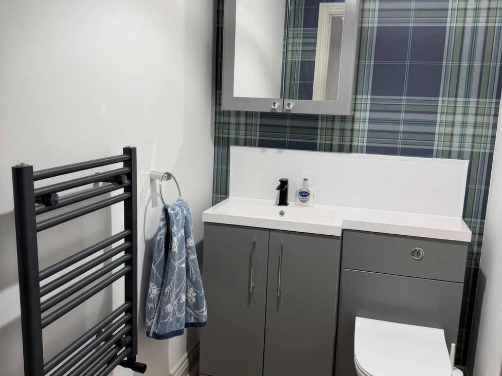 A bathroom with a sink and toilet at Ridings Annex in Tonbridge