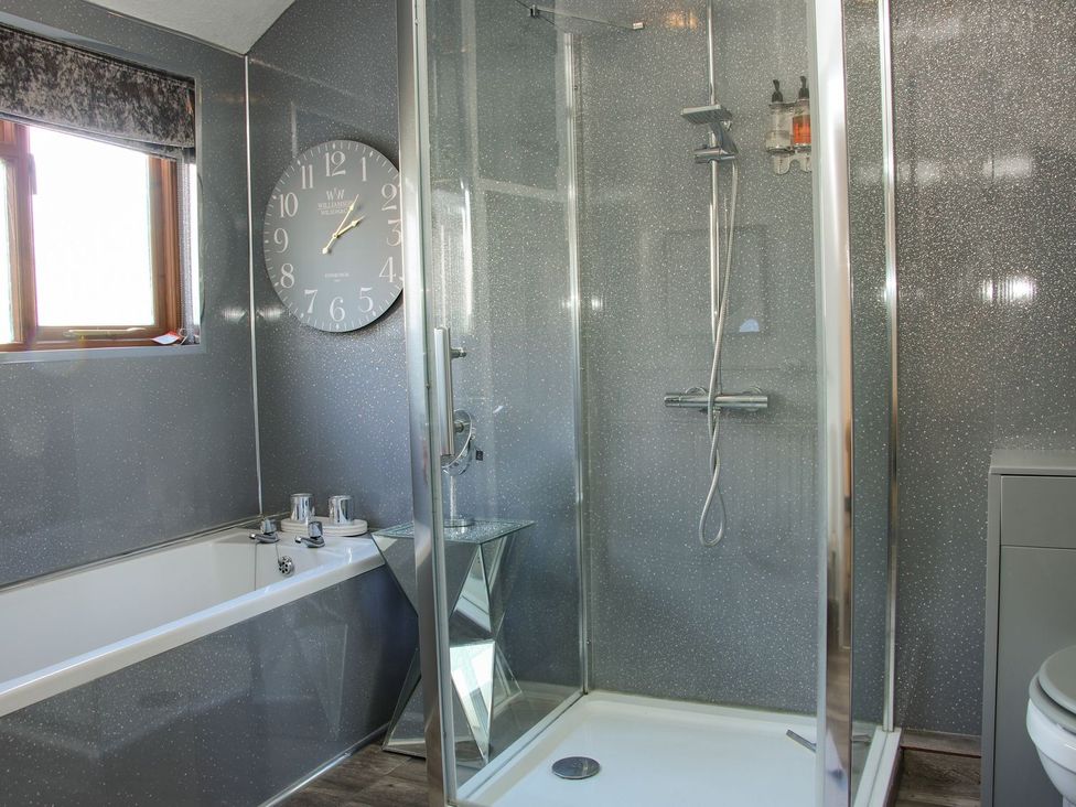 A bathroom featuring a bathtub and a shower at The Half Boar in Bishop's Castle