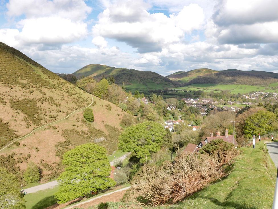 A view of mountains and a village from above at The Half Boar in Bishop's Castle