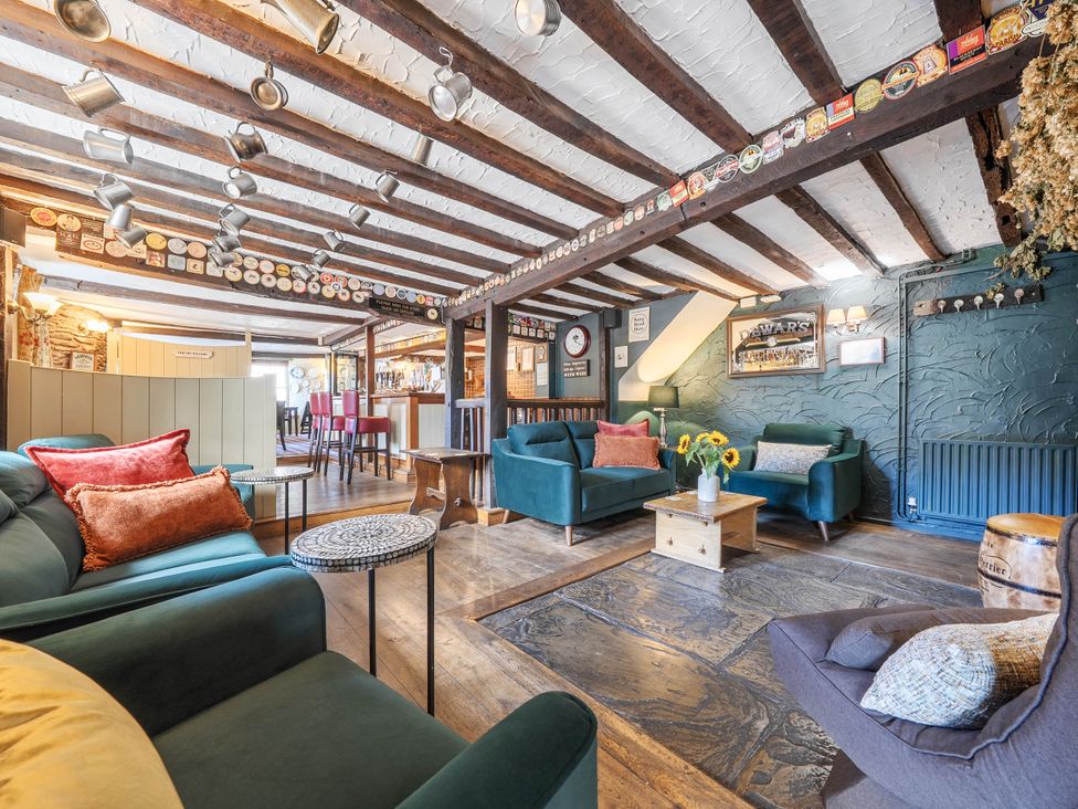 A snug with sofas and a coffee table at The Half Boar in Bishop's Castle
