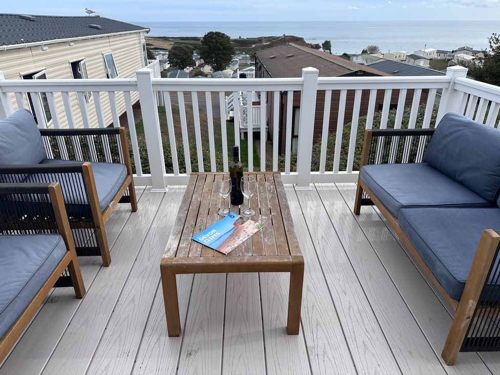 An outdoor seating area with chairs and a table at Club Sahara Sandy Bay, Exmouth