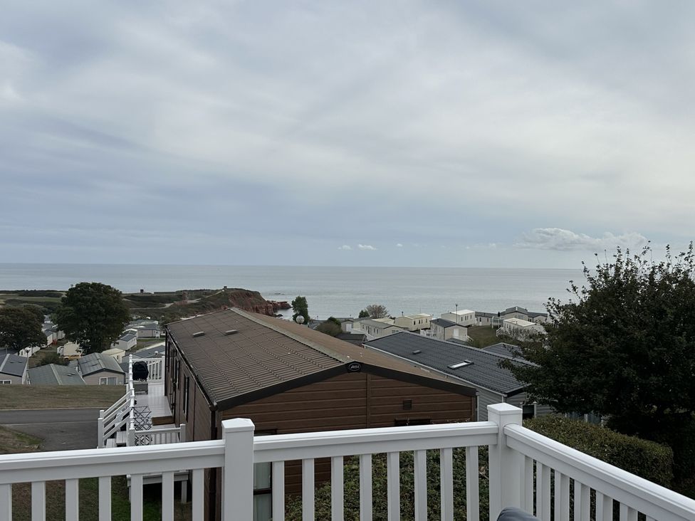 A view of houses and ocean from a balcony at Club Sahara, Sandy Bay, Exmouth