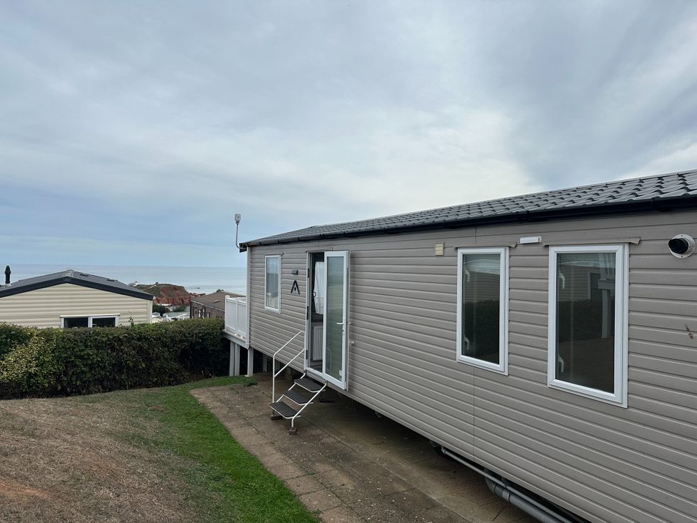 A mobile home with a patio and windows at Club Sahara Sandy Bay, Exmouth