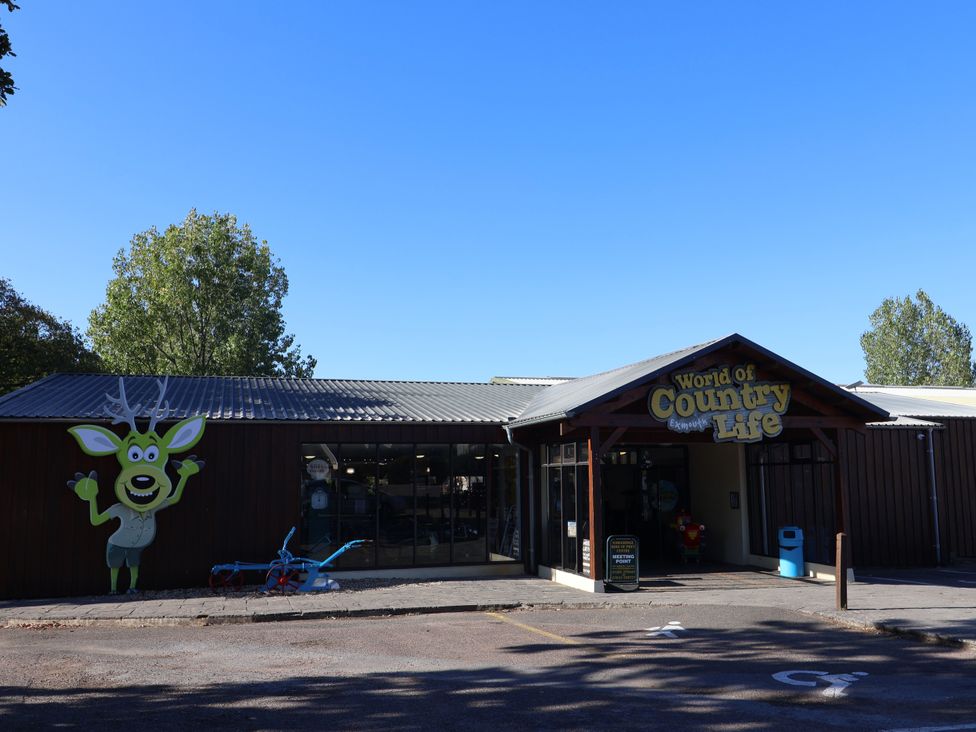 A building with a sign and entrance at World of Country Life in Sandy Bay, Exmouth