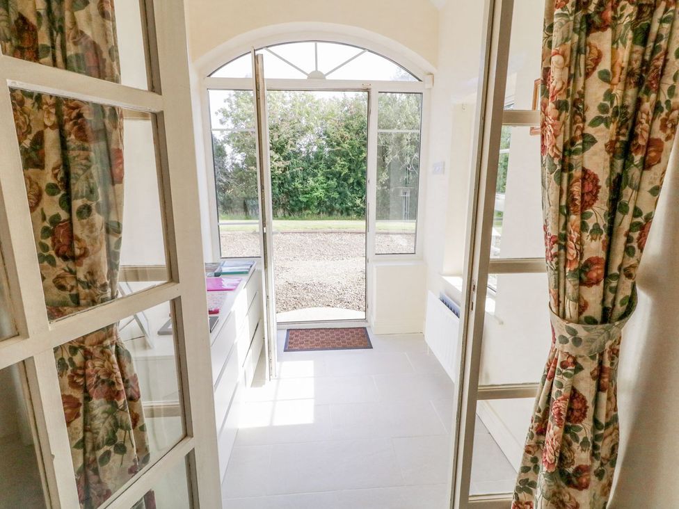 An entrance area with a door and curtains at Craiglea Lodge in Coleraine