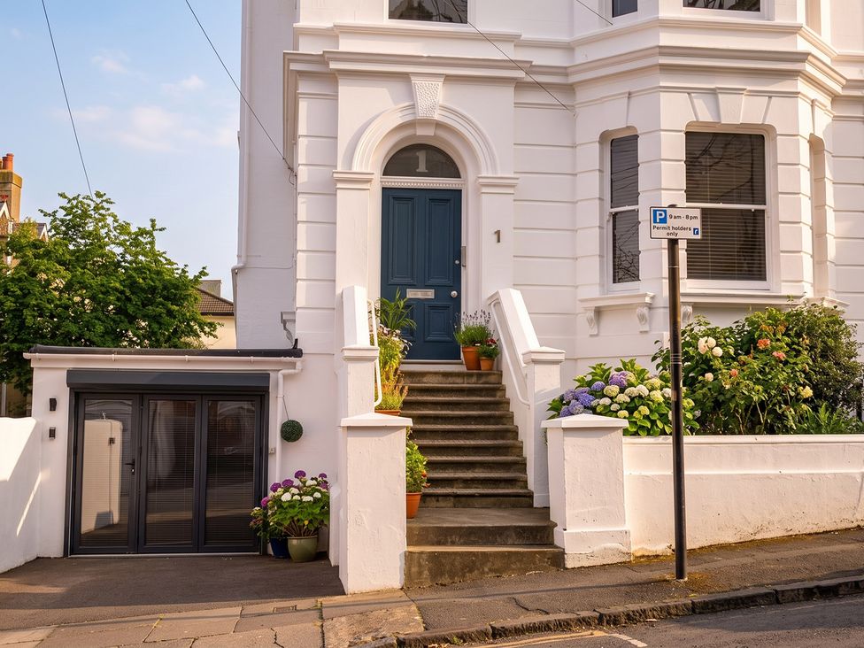 An entrance with stairs and planters at Gorgeous 2Bed Apartment with Patio in Brighton And Hove