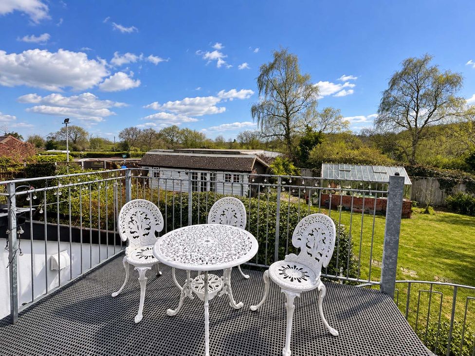 An outdoor seating area with table and chairs at Holdfast Cottage Sleeps 12 in The New Forest, Bramshaw near Totton, Hampshire