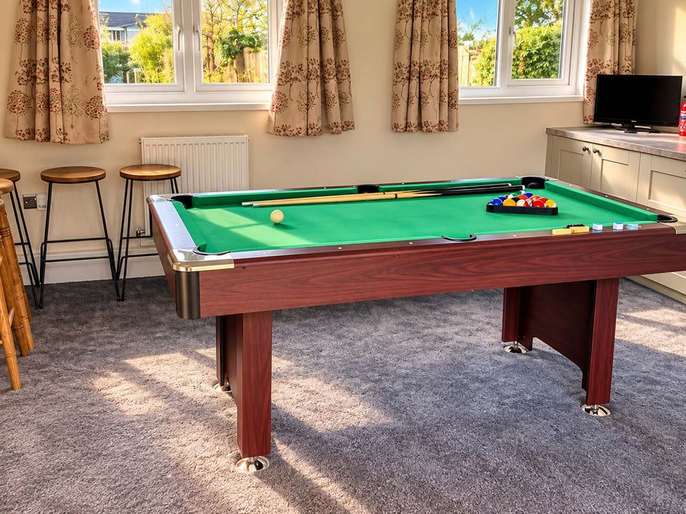 A games room with a pool table and stools at Holdfast Cottage Sleeps 12 in The New Forest, Bramshaw near Totton, Hampshire