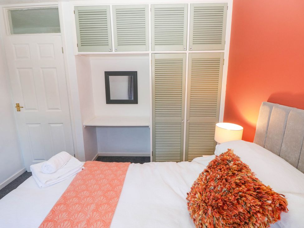 A bedroom with a bed and wardrobe at 24 Little Castle Grove in Hubberston