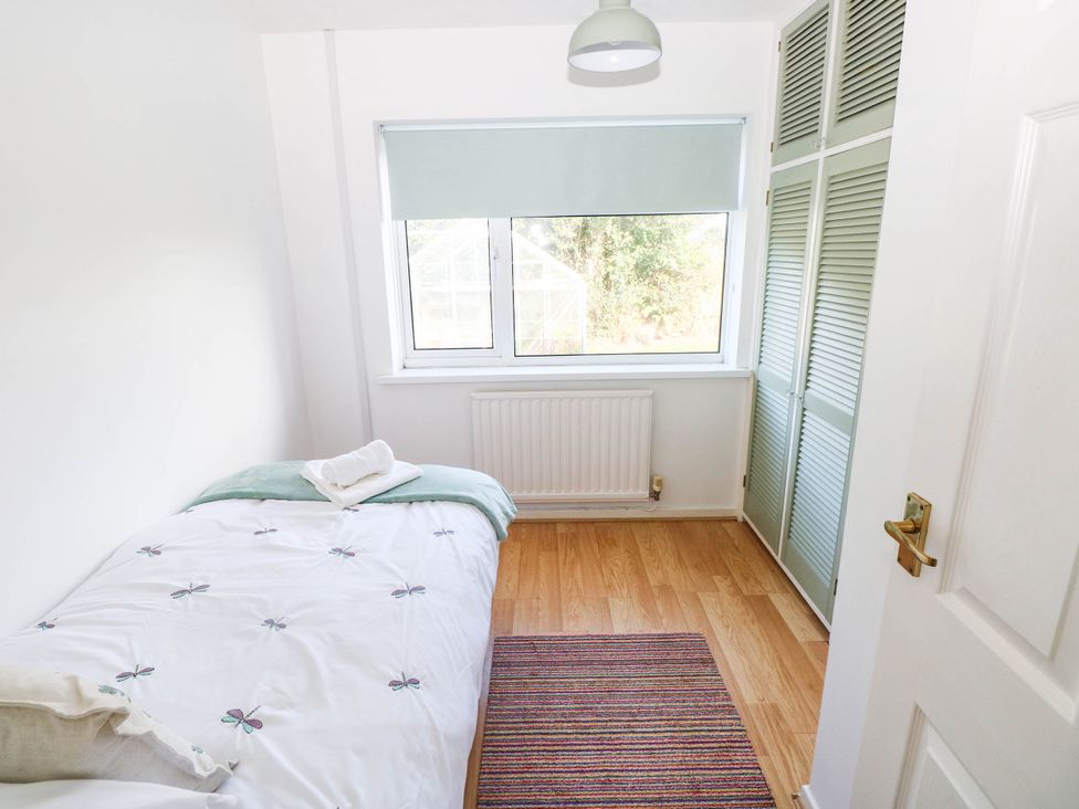 A bedroom with a bed and a window at 24 Little Castle Grove, Hubberston