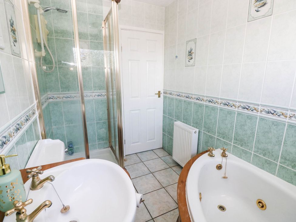 A bathroom featuring a shower and bathtub at 24 Little Castle Grove Hubberston