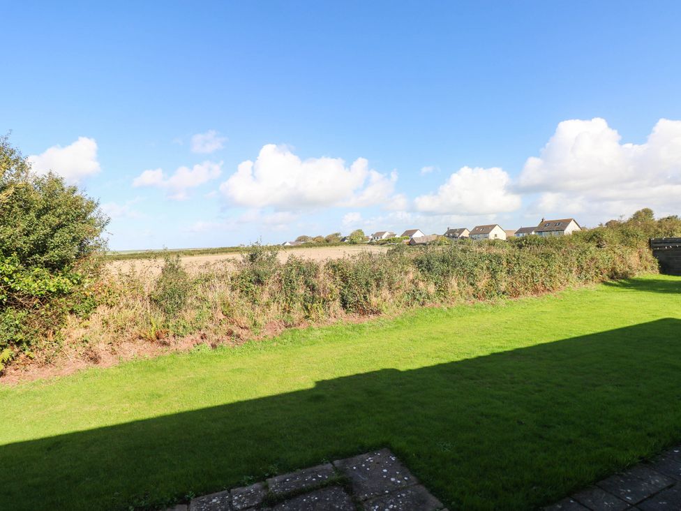A field with grass and houses in the distance at 24 Little Castle Grove Hubberston