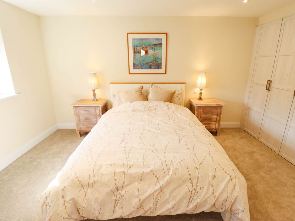 A bedroom with a bed and bedside tables at Three Chimneys in Scampton near Ingham