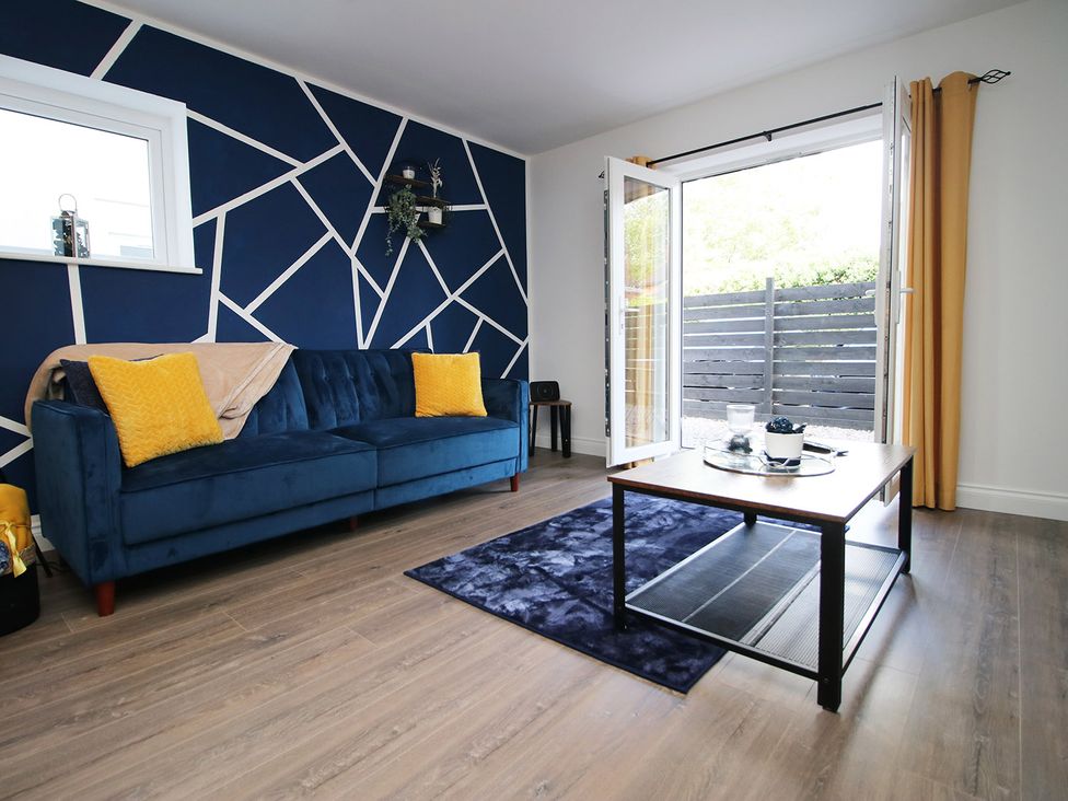 A living room with a sofa and coffee table at 2 bed Cardiff city centre apartment in Cardiff