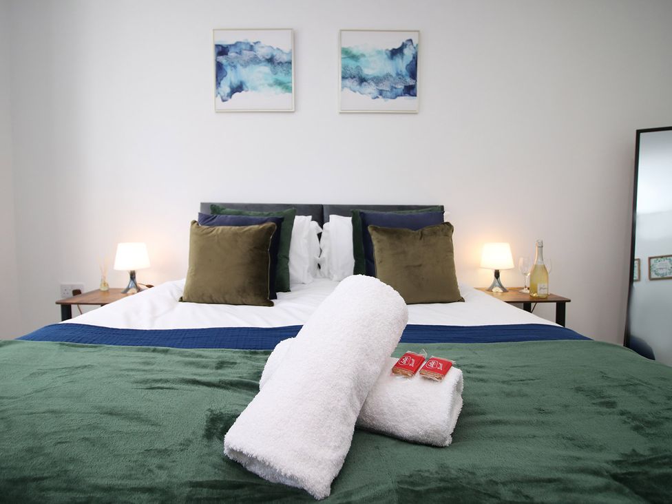 A bedroom with a bed and pillows at 2 bed Cardiff city centre apartment Cardiff