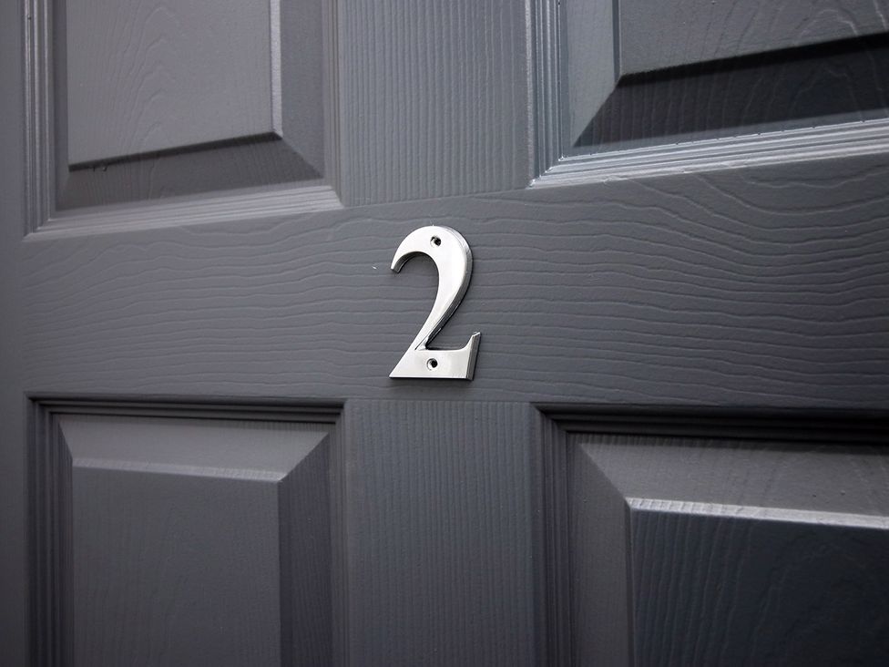 A door with the number 2 displayed at 2 bed Cardiff city centre apartment in Cardiff