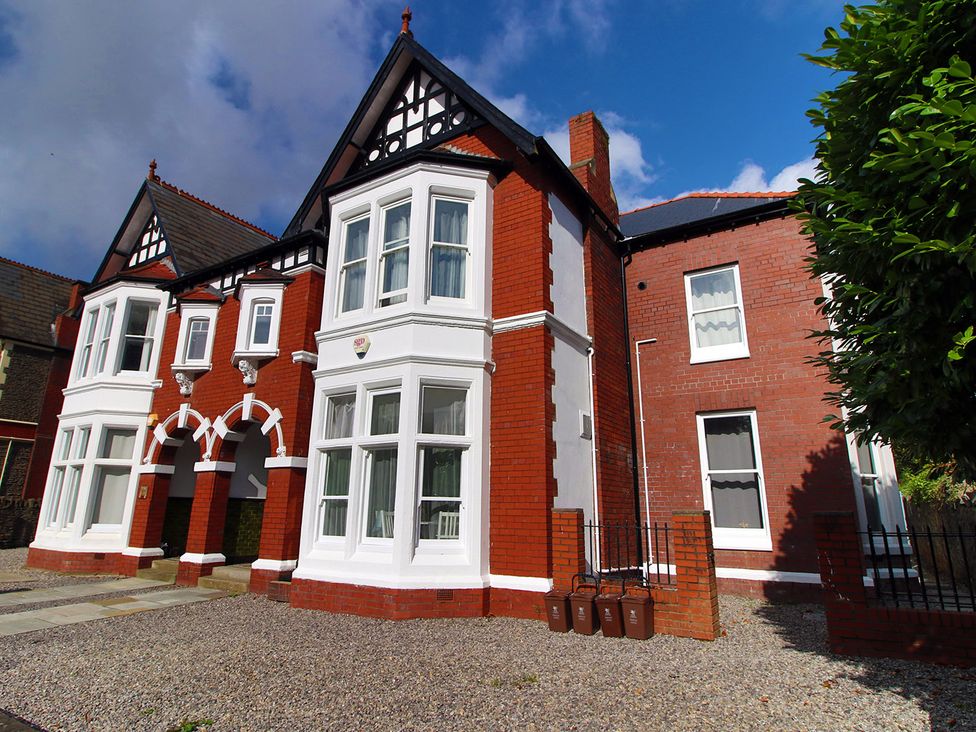 A house with multiple windows and doors at 2 bed Cardiff city centre apartment Cardiff