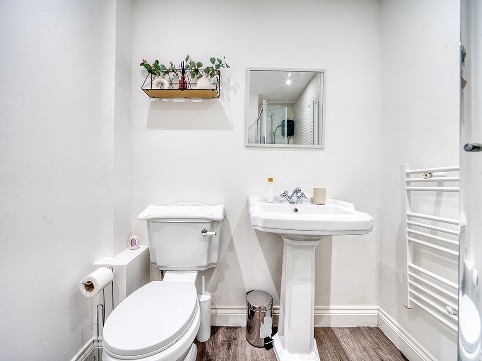 A bathroom with a sink and toilet at Stunning 2 Bed by the City Centre and Bute Park Cardiff
