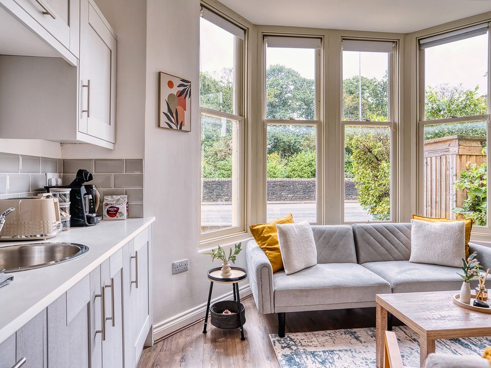 A living room with a couch and coffee machine at Stunning 2 Bed by the City Centre and Bute Park in Cardiff