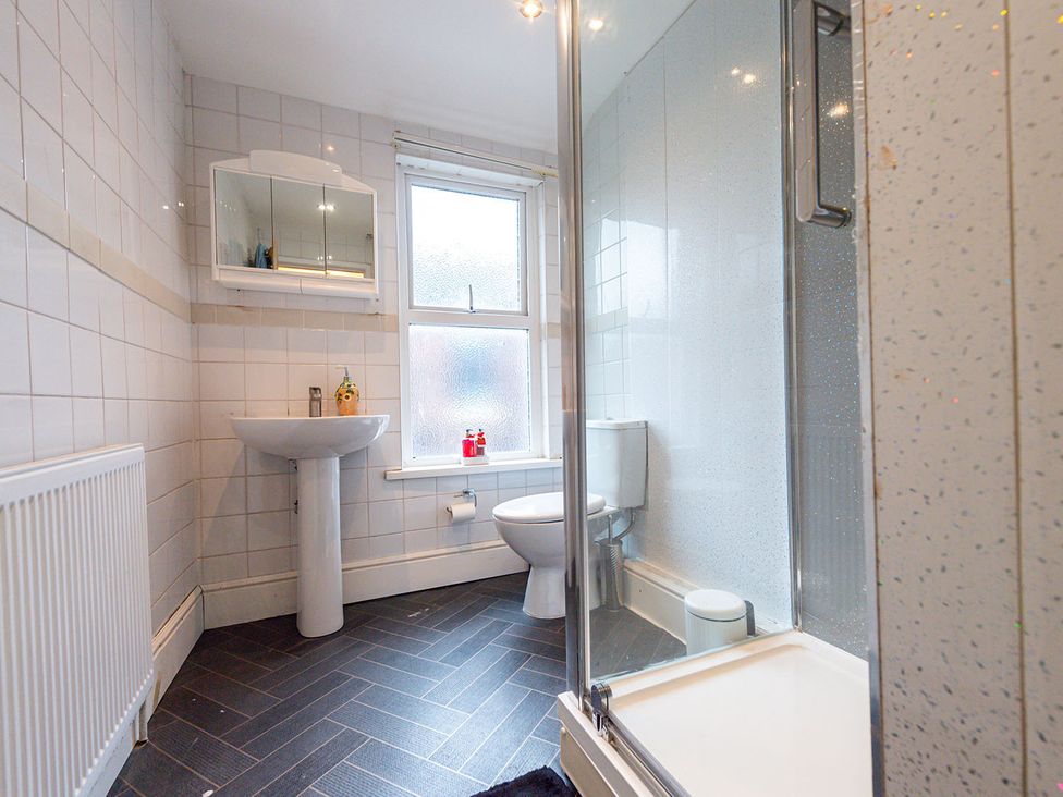A bathroom with shower and sink at 5 Bed House, sleeping 10 in the City Centre, Liverpool
