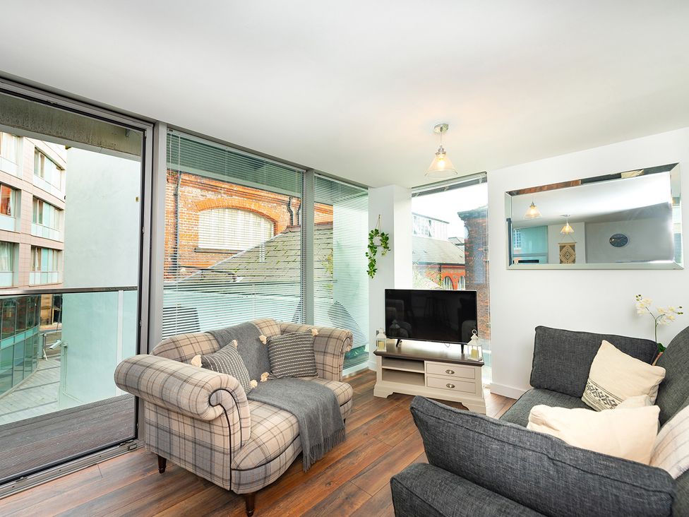 A living room with a sofa and television at City Centre Apartment, 2 bed with Free Parking, Liverpool
