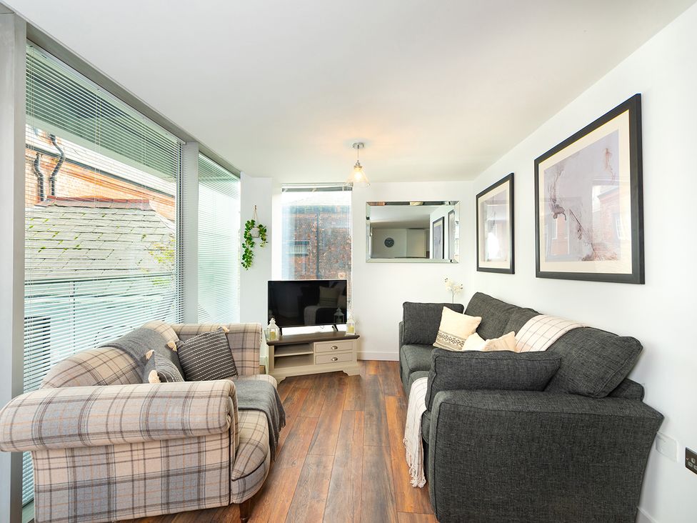 A living room with a sofa and television at City Centre Apartment, 2 bed with Free Parking, Liverpool