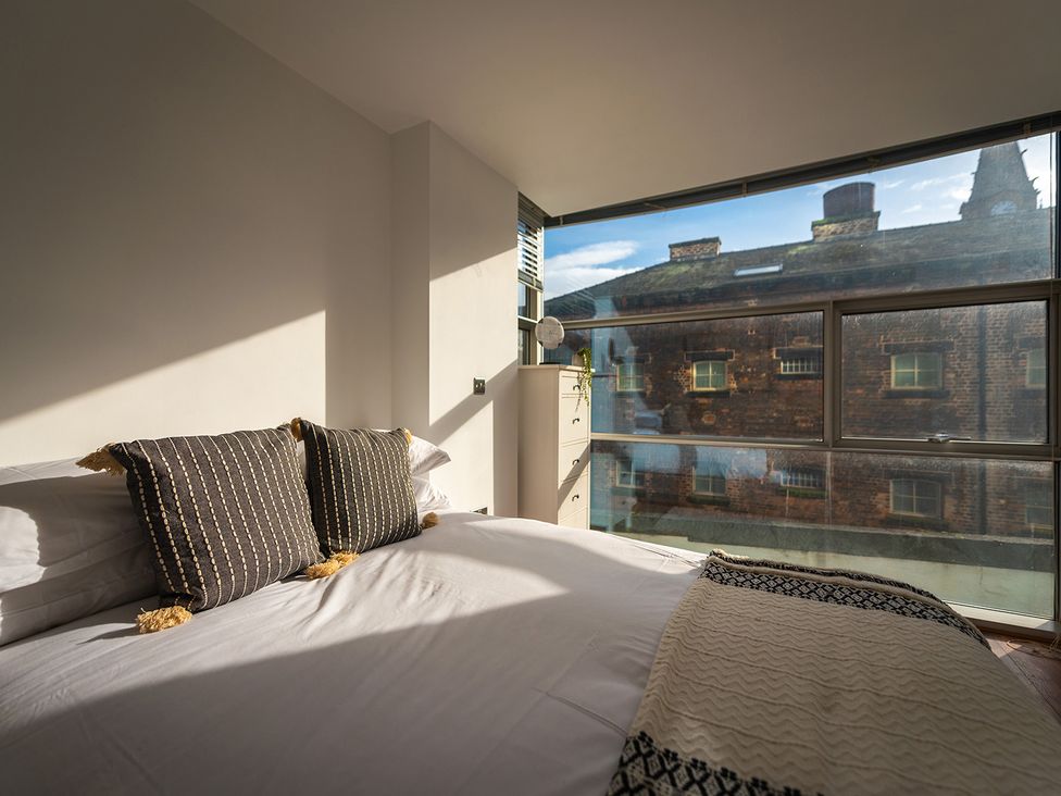 A bedroom with a bed and window view at City Centre Apartment, 2 bed with Free Parking in Liverpool