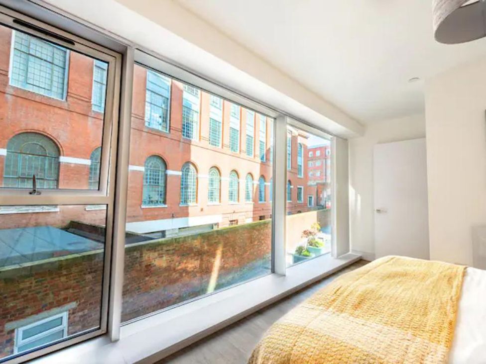 A bedroom with a window and bed at Luxury City Centre Apartment, Prime Location Liverpool
