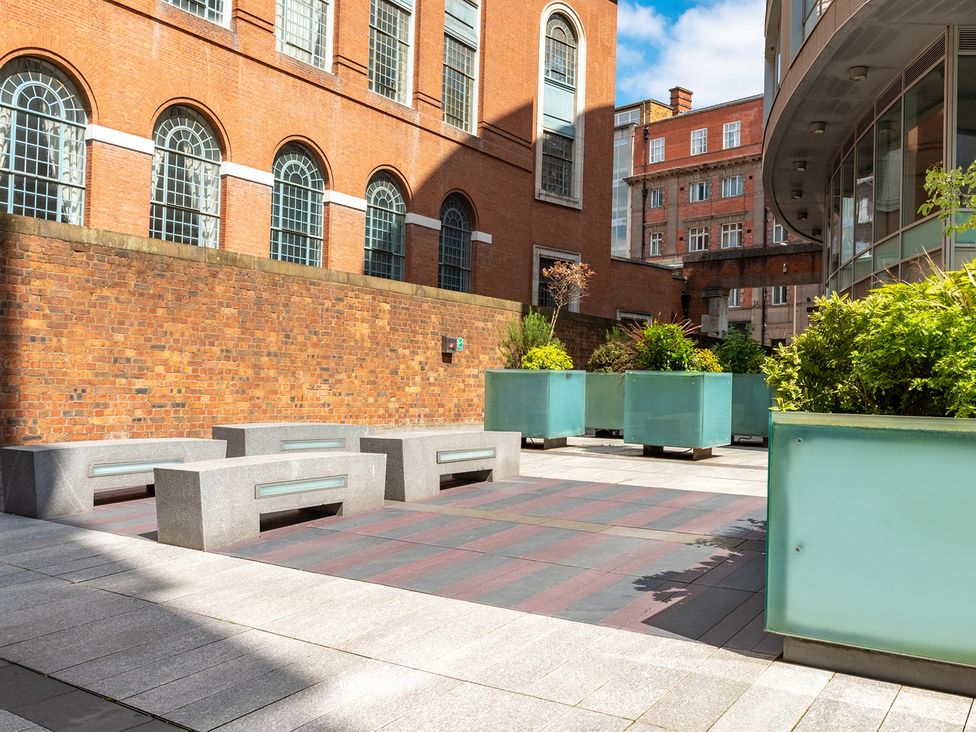 An outdoor area with benches and planters at Luxury City Centre Apartment, Prime Location, Liverpool