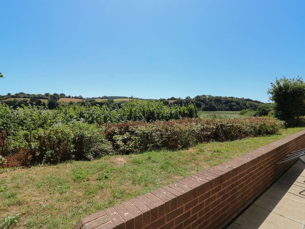 A view of a field and trees at Egret in Kingsteignton