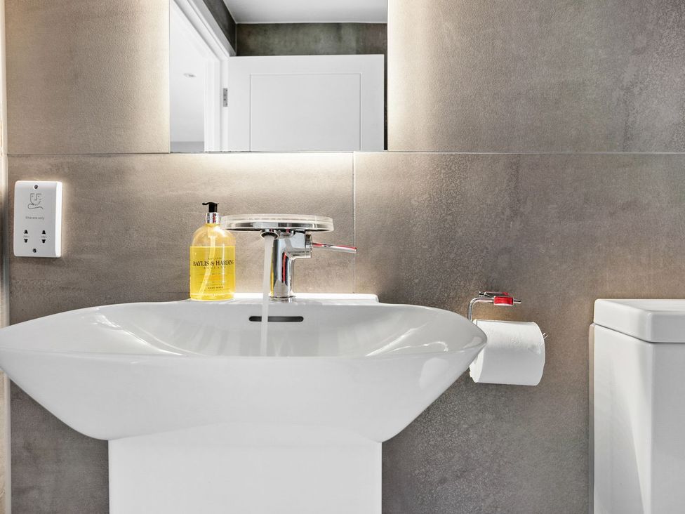 A bathroom with a sink and toilet at Huxham View & Annex in Kingsteignton