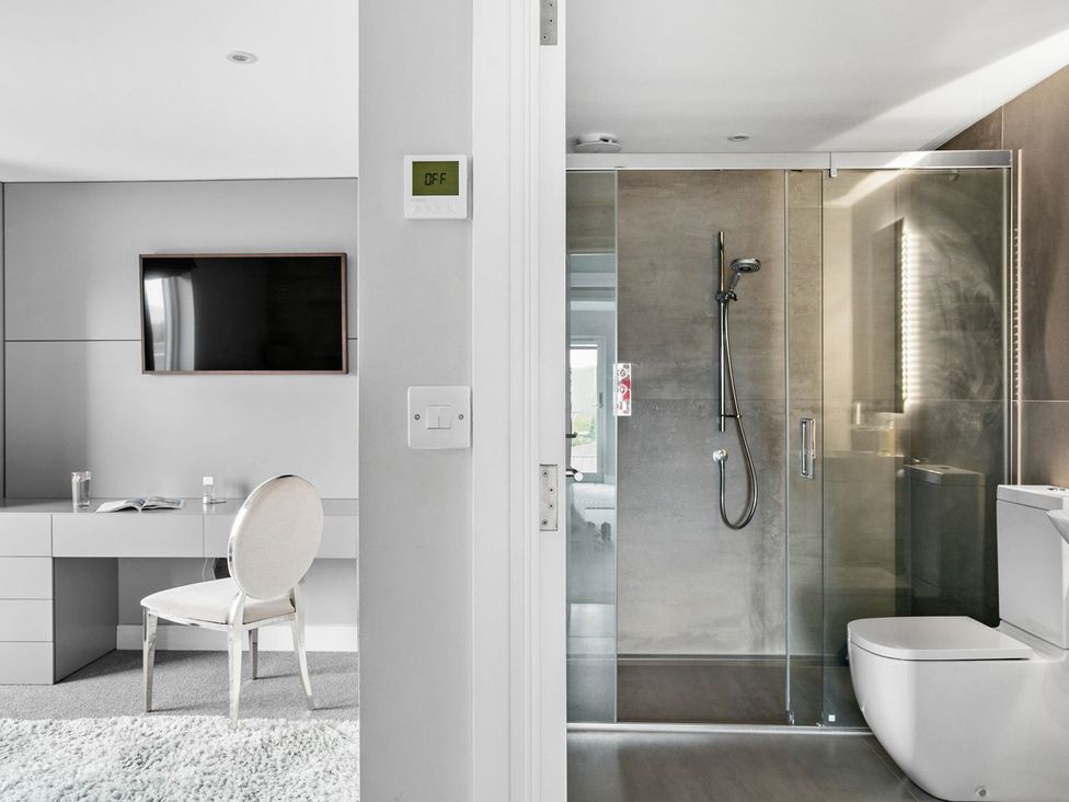 A bathroom with shower and toilet at Huxham View & Annex Kingsteignton
