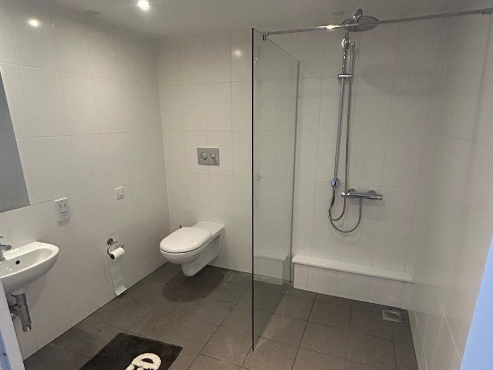 A bathroom with a toilet, sink, and shower at 1 Bed Studio, Sleeps 2 with City Views Liverpool
