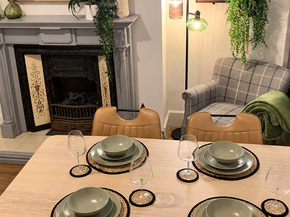 A dining room with a table set for four at 2 Bed House in Creswell, Sleeps 7 with Street Parking