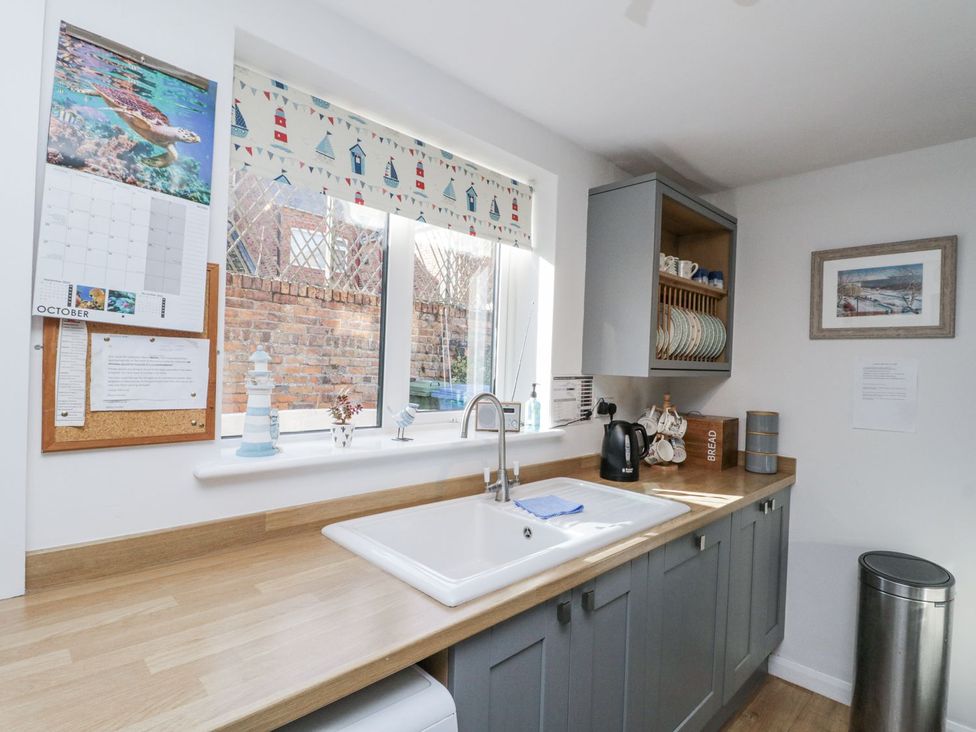 A kitchen with a sink and kettle at Chapel Cottage, Filey