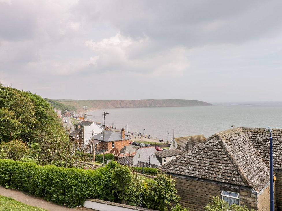A coastal view with houses and the sea at Chapel Cottage in Filey